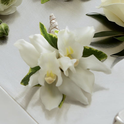 White Mini Cymbidium Boutonniere – AZAR FLRST INC/NEWPORT BEACH FLRST & GDN, Irvine CA